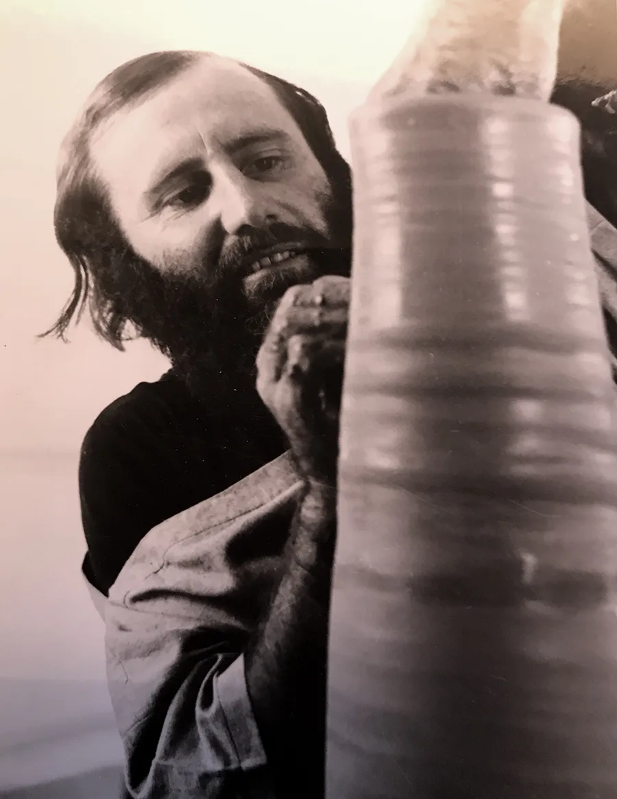 Col Levy throwing a pot on a wheel, c1960s. Photo: Courtesy Levy family