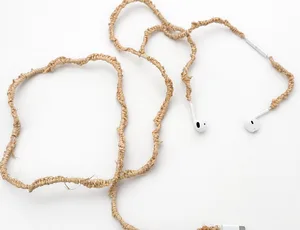 Benjamin Akuila Hearings 2025 earphones and raffia 1