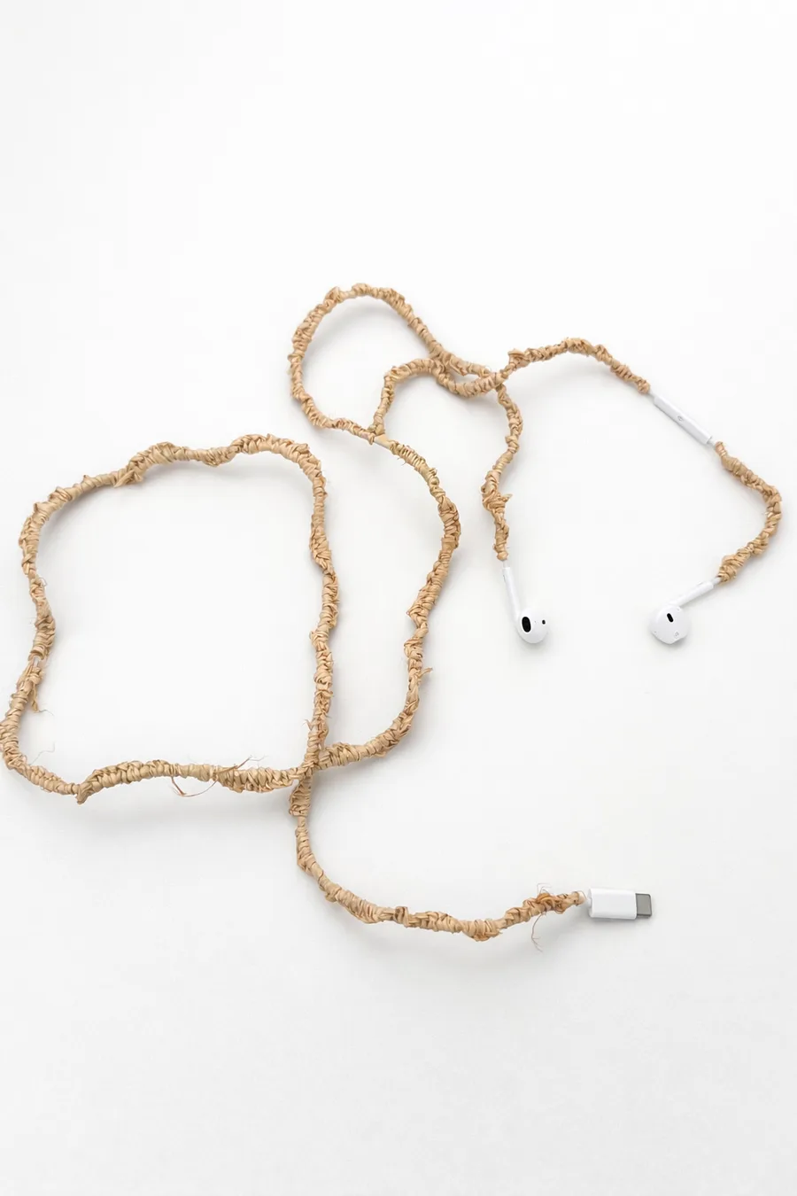 Benjamin Akuila Hearings 2025 earphones and raffia 1