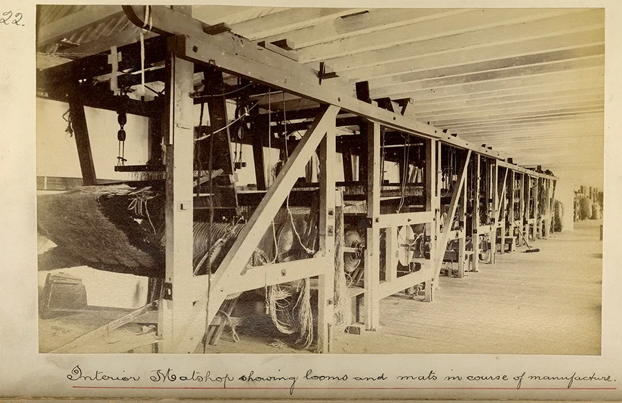 Interior mat-shop, showing looms c1885-1890, sepia albumen photograph 12.4 x 20.1cm