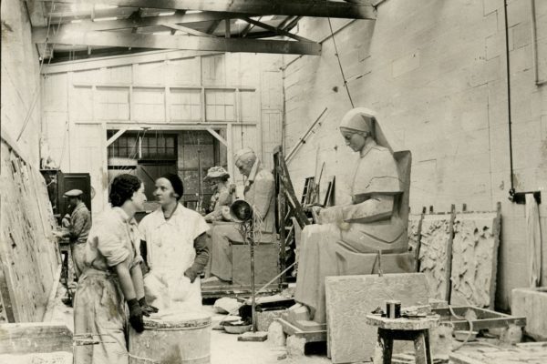 Rayner Hoff’s studio, Building 11. NAS students Treasure Conlon and Eileen McGrath working on the sculptures for the Anzac Memorial in Hyde Park, 1932.